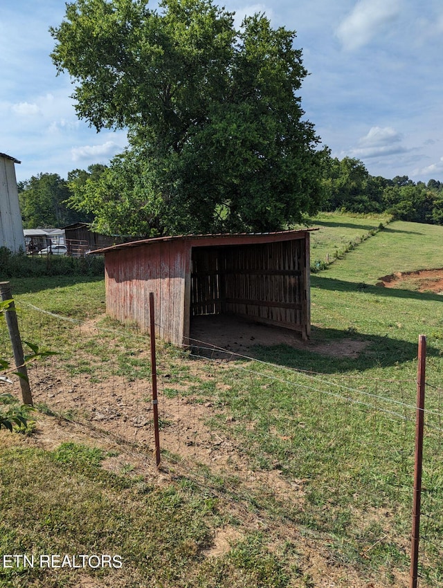 view of pole building with a yard