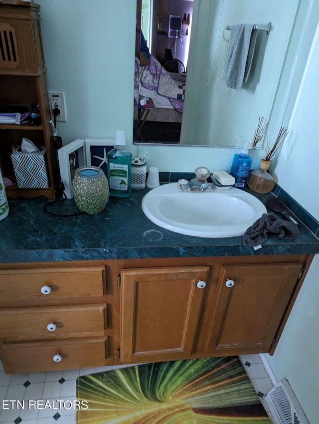 bathroom featuring vanity and visible vents