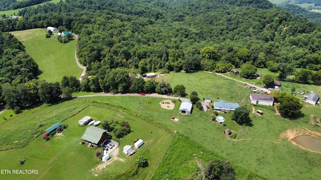 aerial view featuring a wooded view