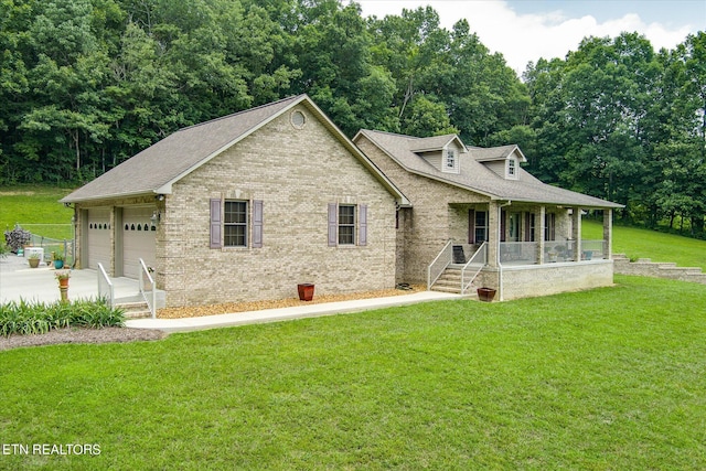 view of front facade with a garage, a front lawn, and a porch