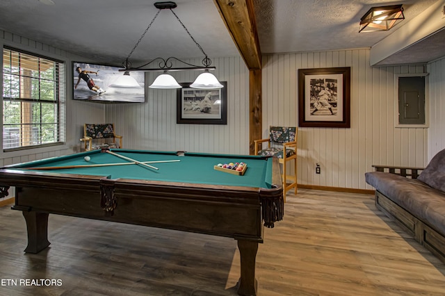 playroom with hardwood / wood-style flooring, pool table, a textured ceiling, electric panel, and beam ceiling