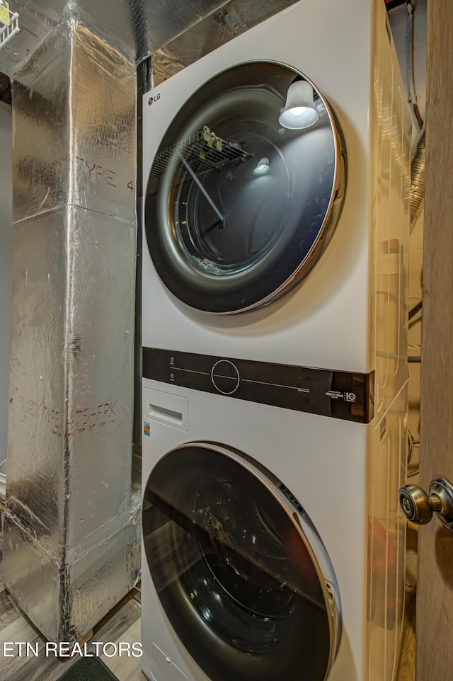 laundry area with stacked washer and clothes dryer