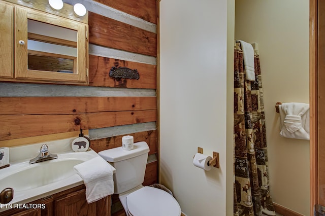 bathroom with toilet and vanity