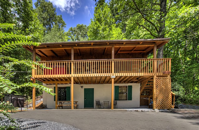 view of front of property with a wooden deck