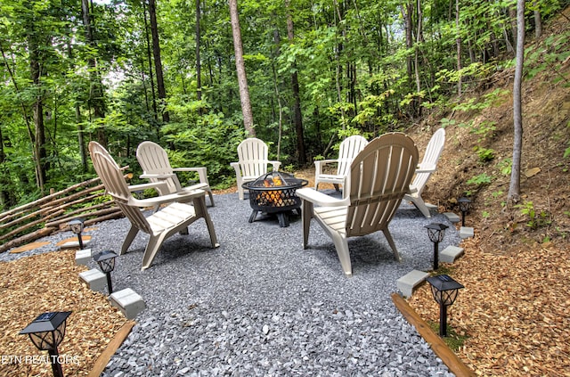 view of patio / terrace featuring an outdoor fire pit