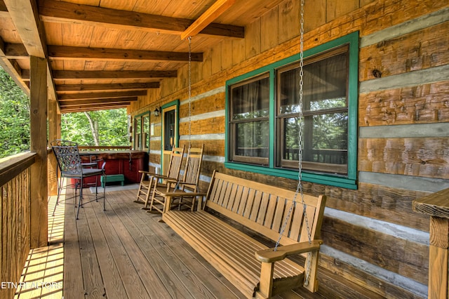 wooden terrace featuring a porch