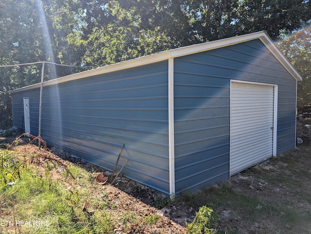 view of outbuilding featuring a garage