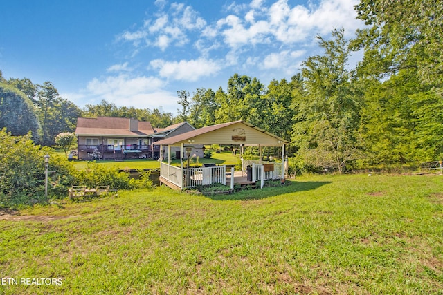 view of yard featuring a gazebo and a deck