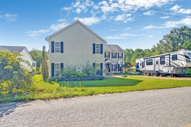 view of front of property with a front lawn