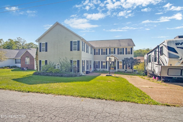 rear view of house with a yard