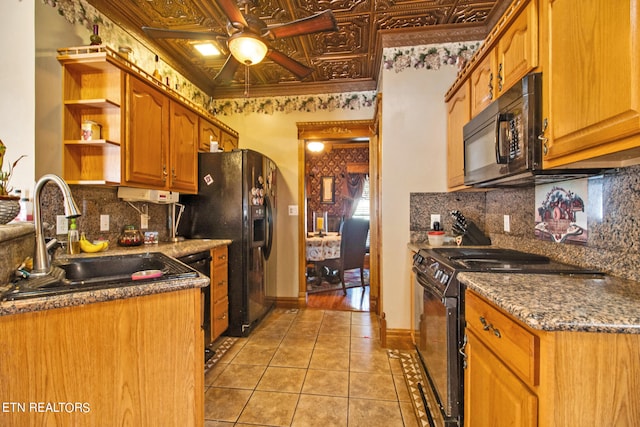 kitchen featuring light hardwood / wood-style floors, black appliances, ceiling fan, and backsplash