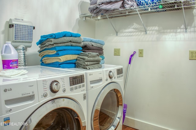 clothes washing area featuring washing machine and clothes dryer