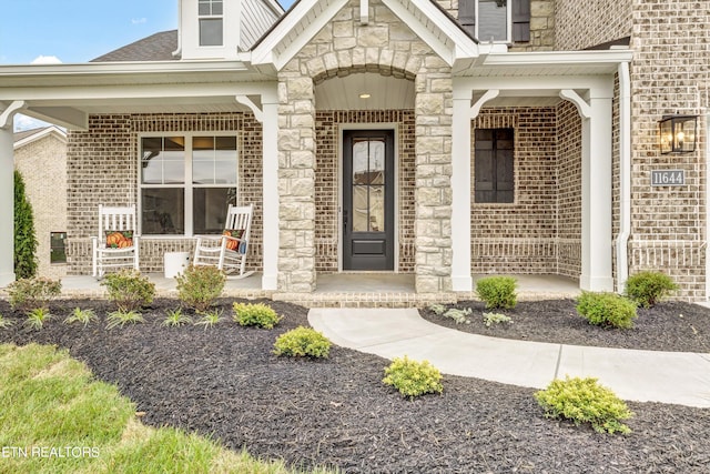 doorway to property featuring a porch