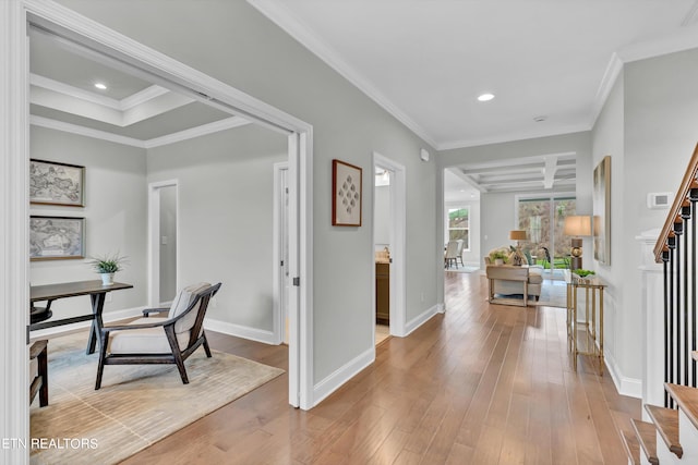 foyer entrance featuring ornamental molding and light wood-type flooring