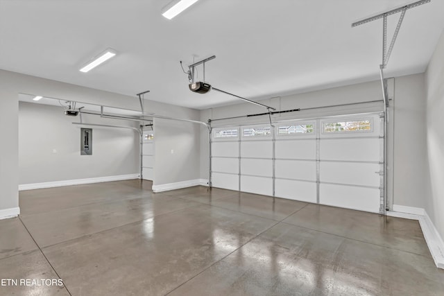 garage featuring electric panel and a garage door opener