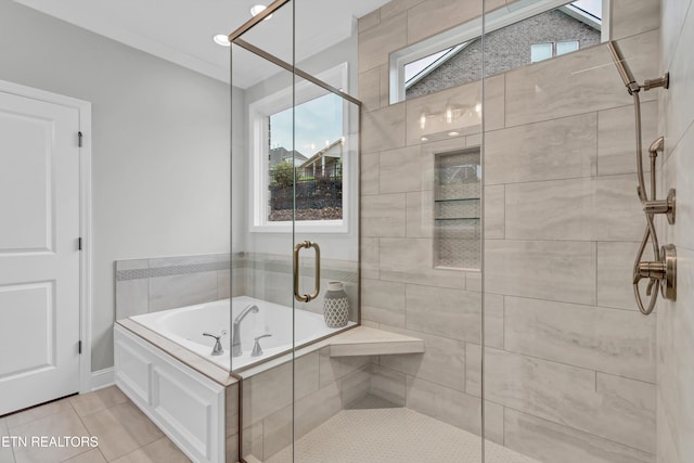 bathroom with shower with separate bathtub, a healthy amount of sunlight, and tile patterned flooring