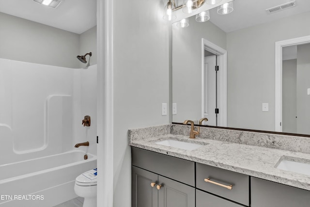 full bathroom featuring toilet, vanity, and shower / bath combination