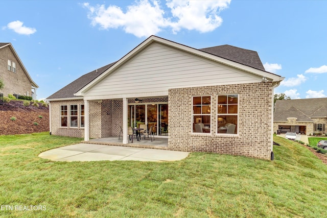 back of house featuring a yard and a patio