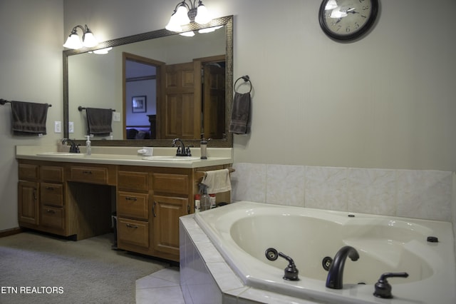 bathroom featuring vanity and tiled tub