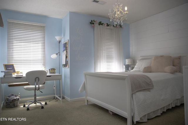 bedroom with a chandelier and carpet