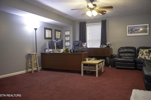 carpeted home office with ceiling fan