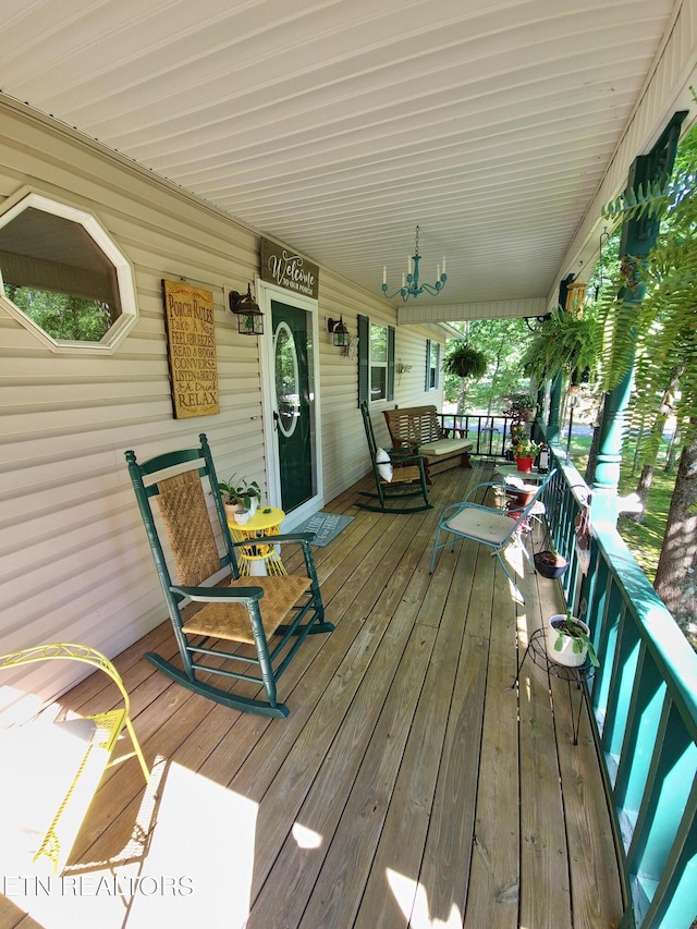 wooden terrace with a porch