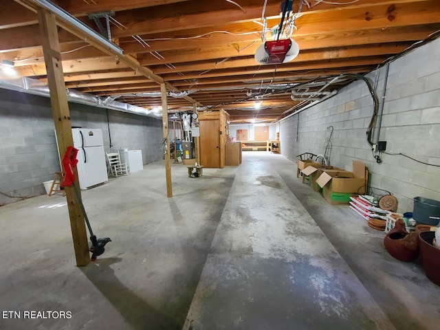 basement featuring white refrigerator