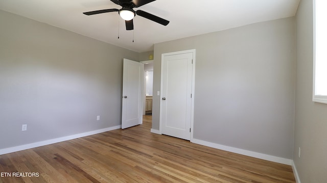 unfurnished bedroom with ceiling fan and light hardwood / wood-style flooring