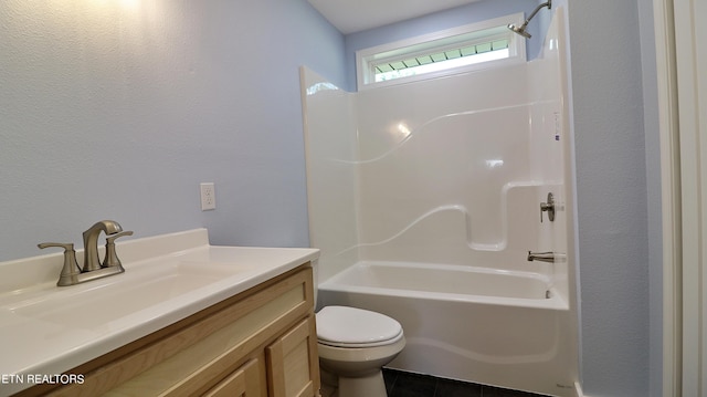 full bathroom featuring toilet, shower / washtub combination, tile patterned flooring, and vanity