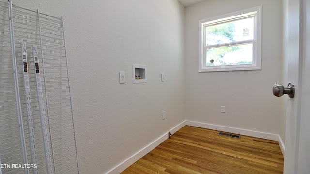 laundry room featuring wood-type flooring and hookup for a washing machine