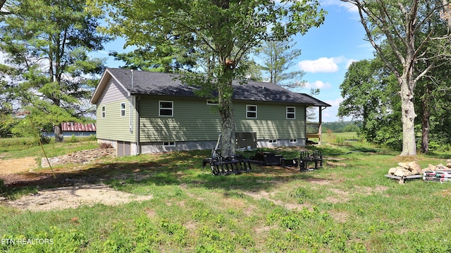 back of house with a yard