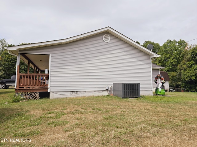 view of home's exterior featuring central AC and a lawn