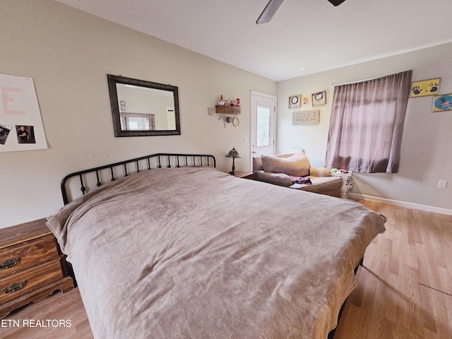 bedroom featuring ceiling fan and light hardwood / wood-style flooring