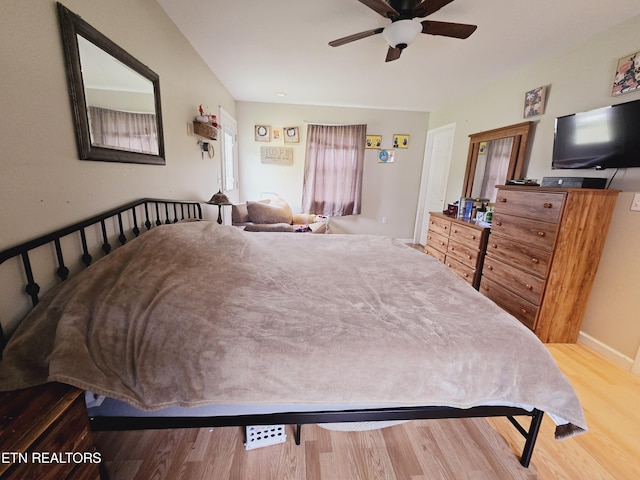 bedroom featuring ceiling fan and hardwood / wood-style floors