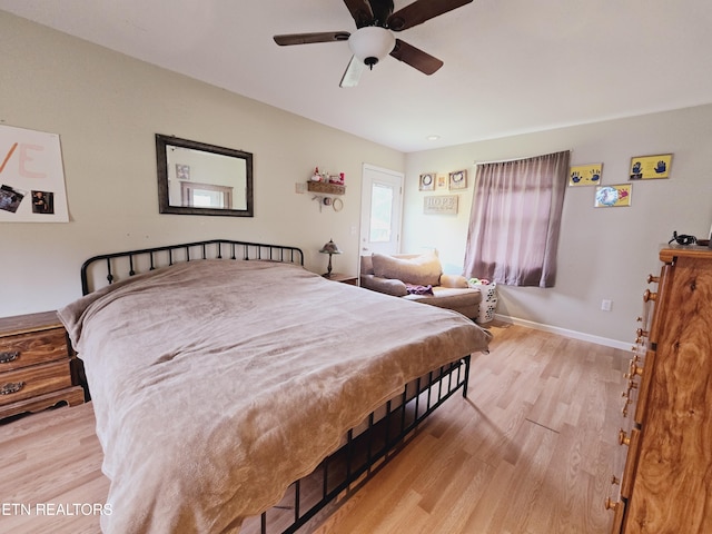 bedroom featuring ceiling fan and light hardwood / wood-style flooring