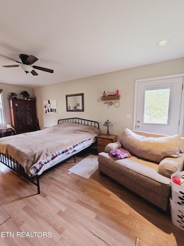 bedroom featuring ceiling fan and hardwood / wood-style floors