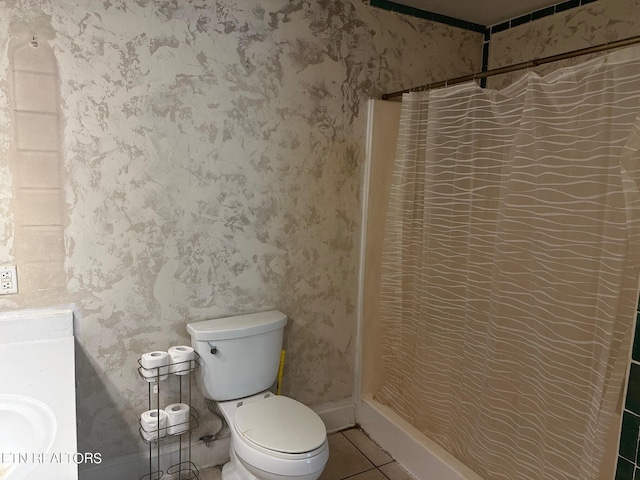 bathroom featuring tile patterned floors, a shower with curtain, toilet, and vanity