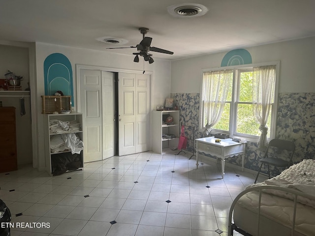 home office featuring ceiling fan and light tile patterned floors