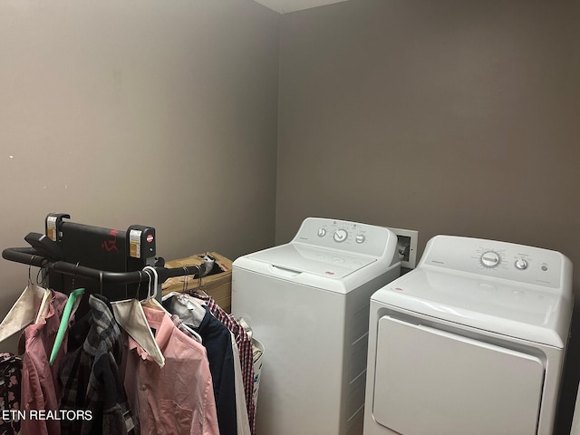 clothes washing area featuring independent washer and dryer