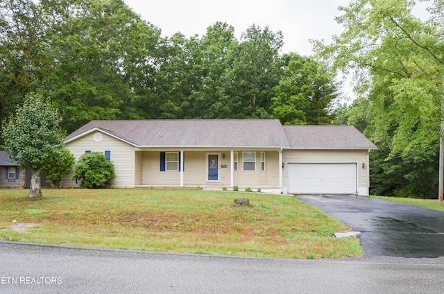 single story home featuring a porch, a garage, and a front lawn