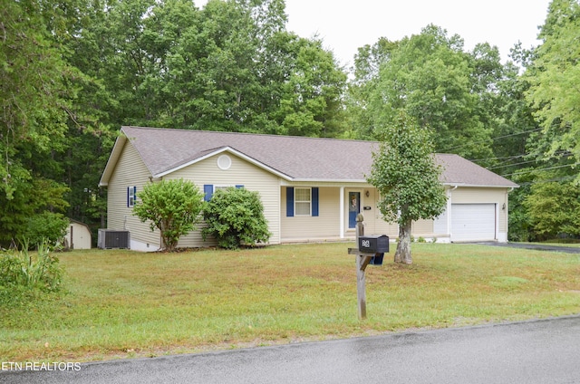 ranch-style house featuring a storage unit, a front lawn, covered porch, central AC unit, and a garage