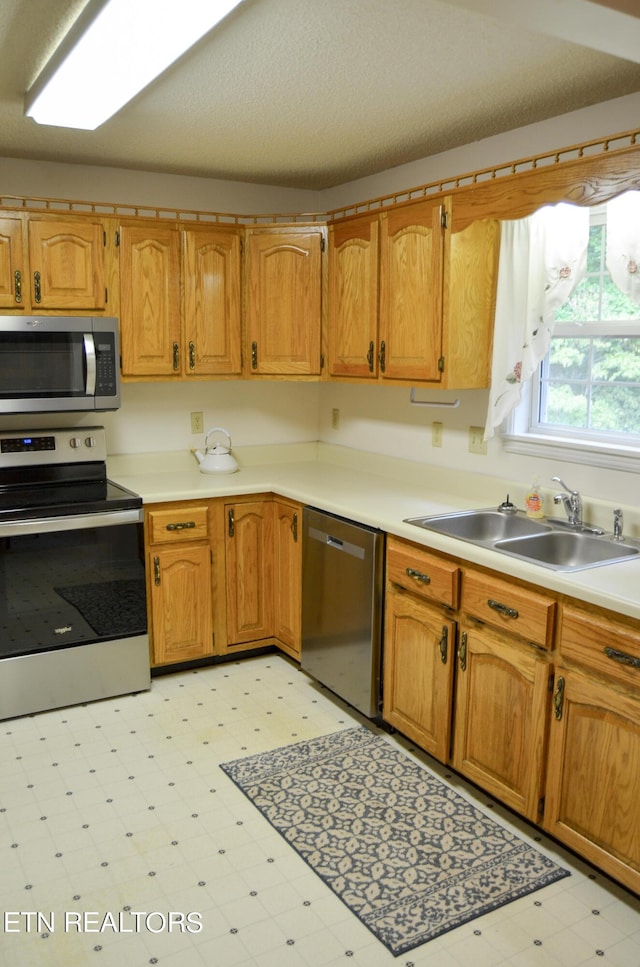 kitchen with appliances with stainless steel finishes and sink