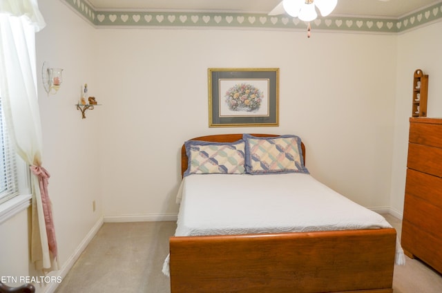 bedroom with light carpet and ceiling fan