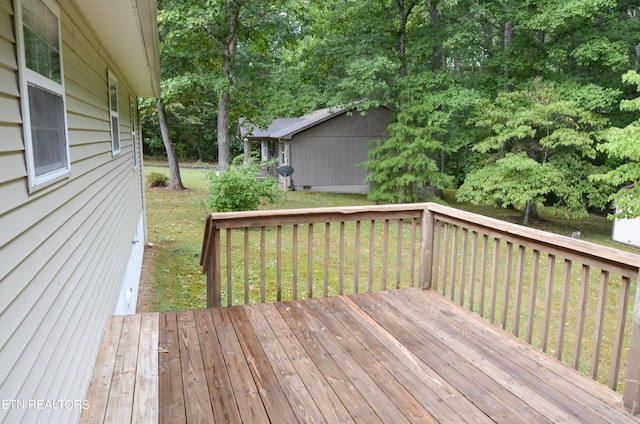 wooden deck with a yard