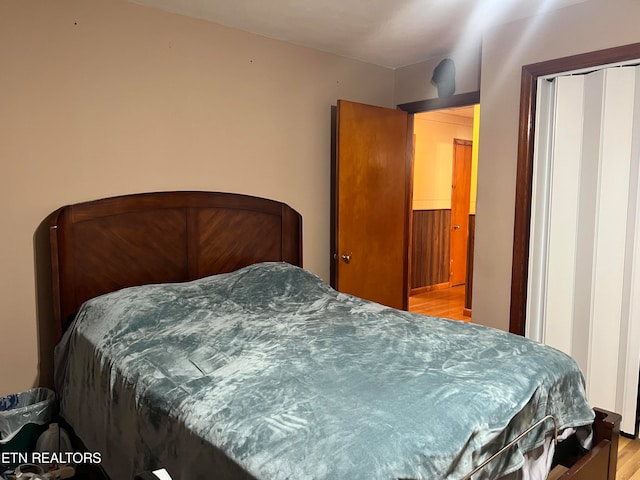 bedroom featuring a closet and light hardwood / wood-style flooring