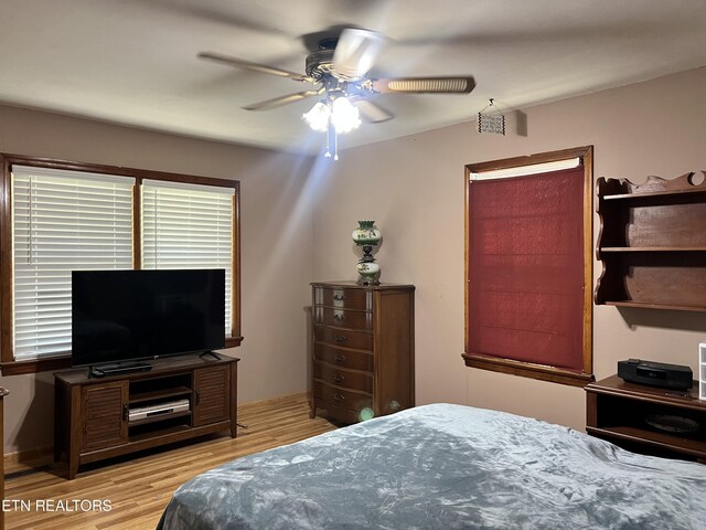 bedroom featuring ceiling fan and light hardwood / wood-style flooring