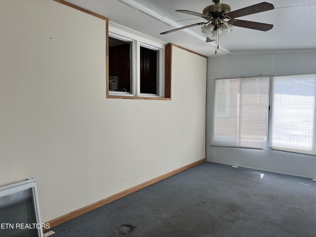 carpeted spare room with ceiling fan