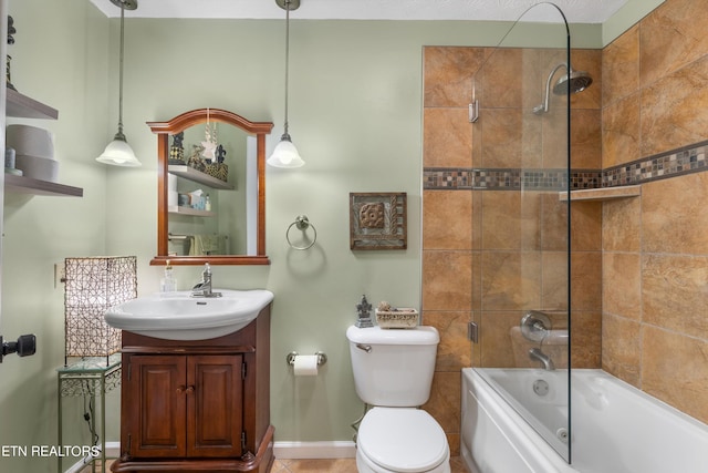 full bathroom featuring toilet, vanity, and tiled shower / bath combo