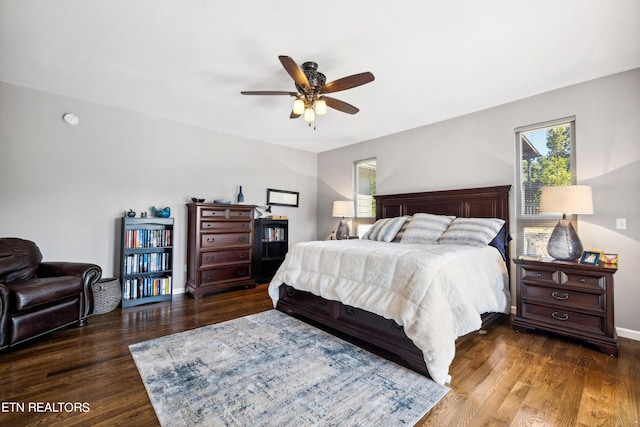 bedroom featuring ceiling fan and dark wood-type flooring