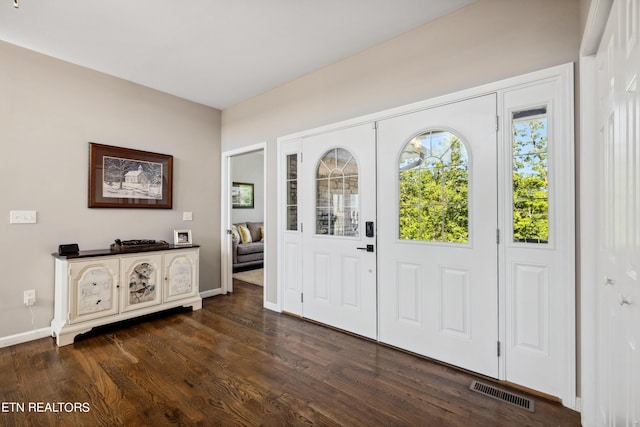 entrance foyer featuring dark hardwood / wood-style flooring